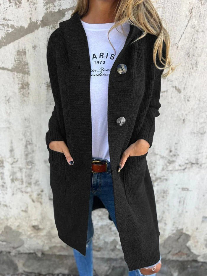 Black hooded longline cardigan with hands in the pockets