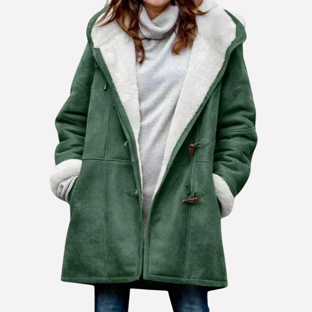 Green hooded toggle front coat worn open over a gray top