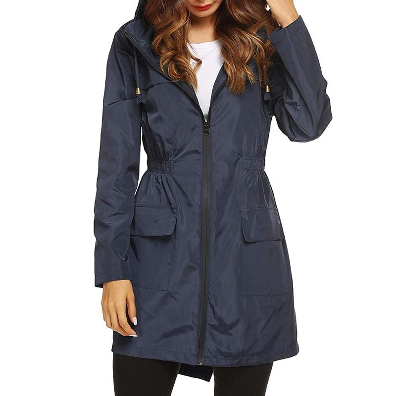 Navy hooded zip front jacket with gathered waist and flap pockets, front view