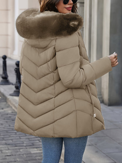 Khaki quilted coat seen from the side with the fur hood up