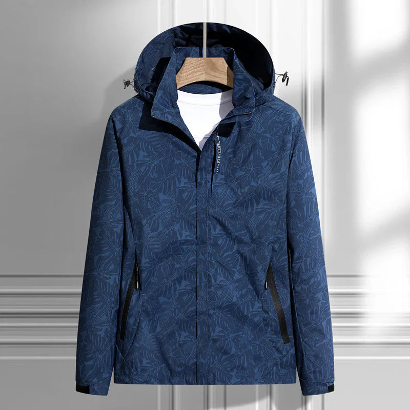 Navy leaf print hooded shell jacket on a hanger