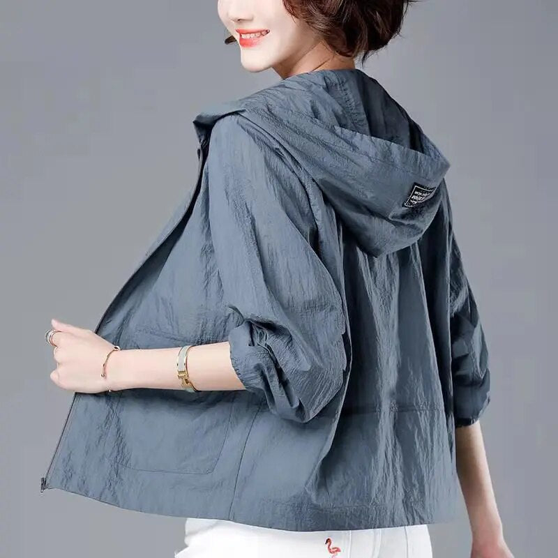 Slate grey hooded zip jacket worn, back view