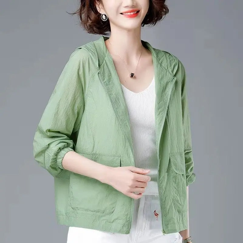 Green hooded zip jacket worn open over a tee, front
