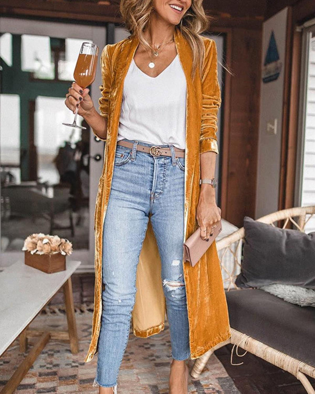 Mustard yellow long velvet duster cardigan on a model with jeans, front view