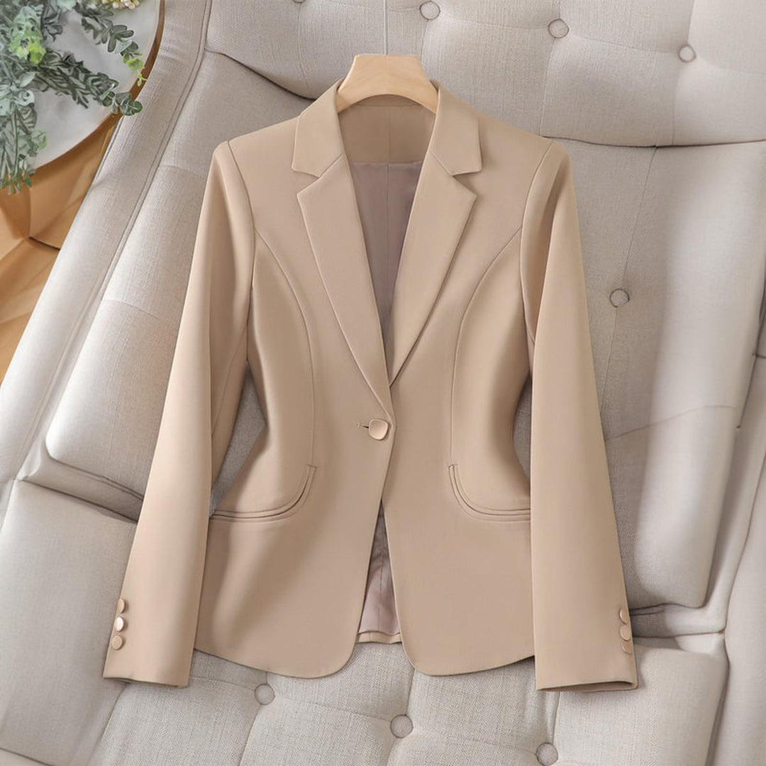 Beige one button fitted blazer on a hanger