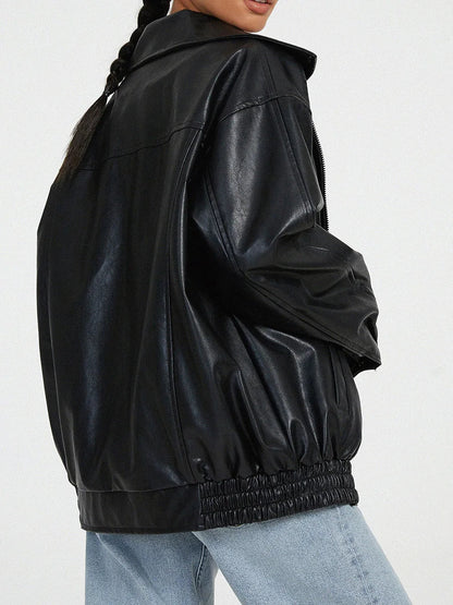 Black oversized bomber jacket from the side showing the gathered hem