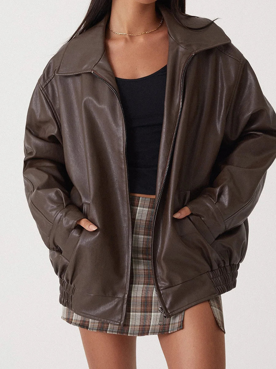 Brown oversized collared bomber jacket worn open, close front view