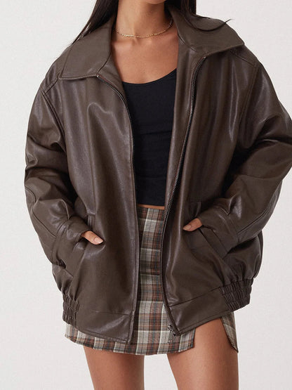 Brown oversized collared bomber jacket worn open, close front view
