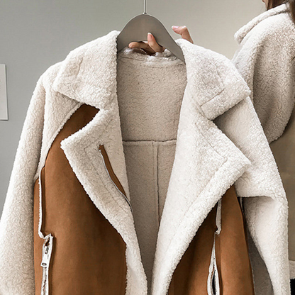Brown contrast panel teddy jacket with a zip front, close view