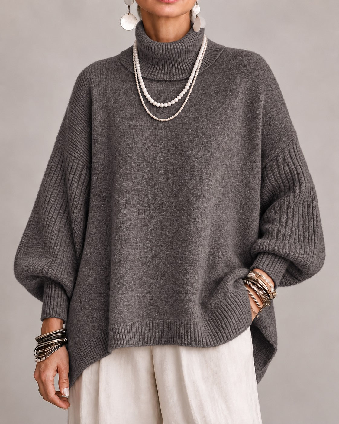 Taupe oversized turtleneck sweater with ribbed balloon sleeves, front view
