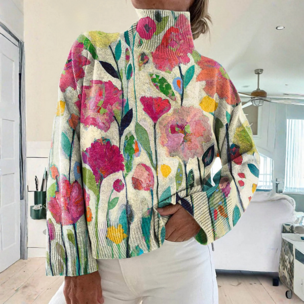 Turtleneck sweater with painted pink and green wildflowers on a light ground