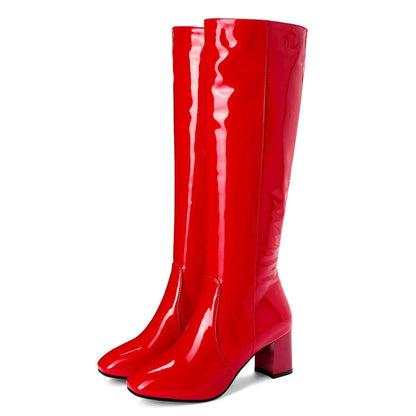 Red patent knee high boots with a side zip, product view