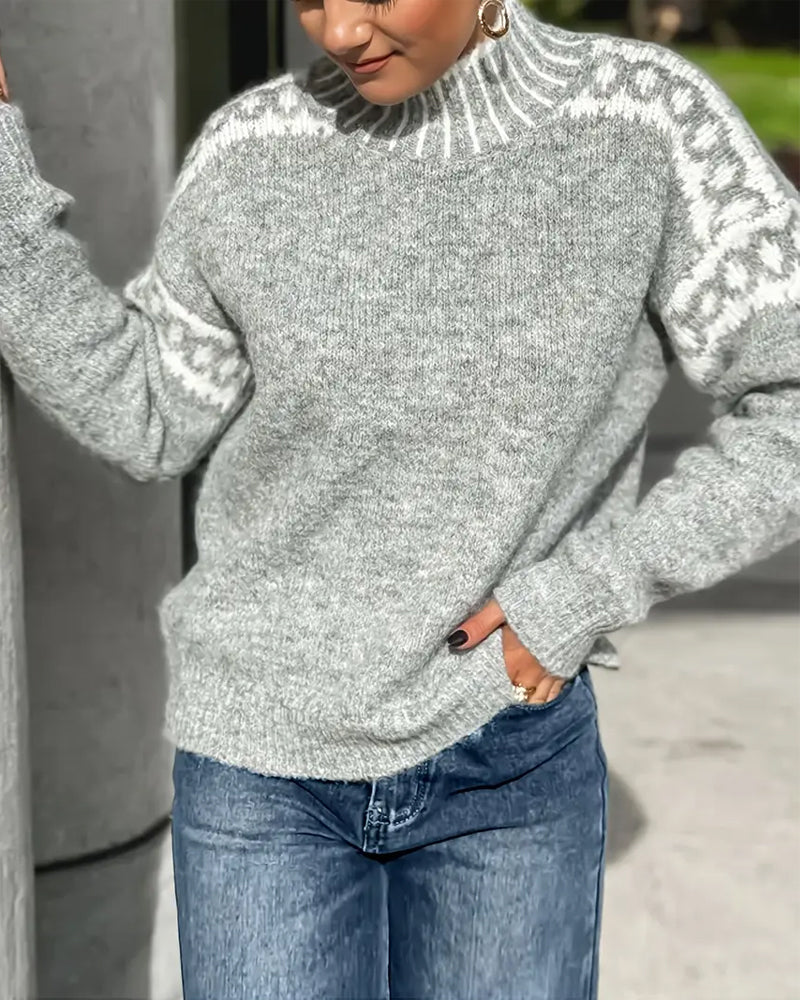 Gray patterned yoke sweater worn with jeans