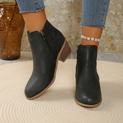 Gray perforated panel ankle boots worn with cropped jeans, front view