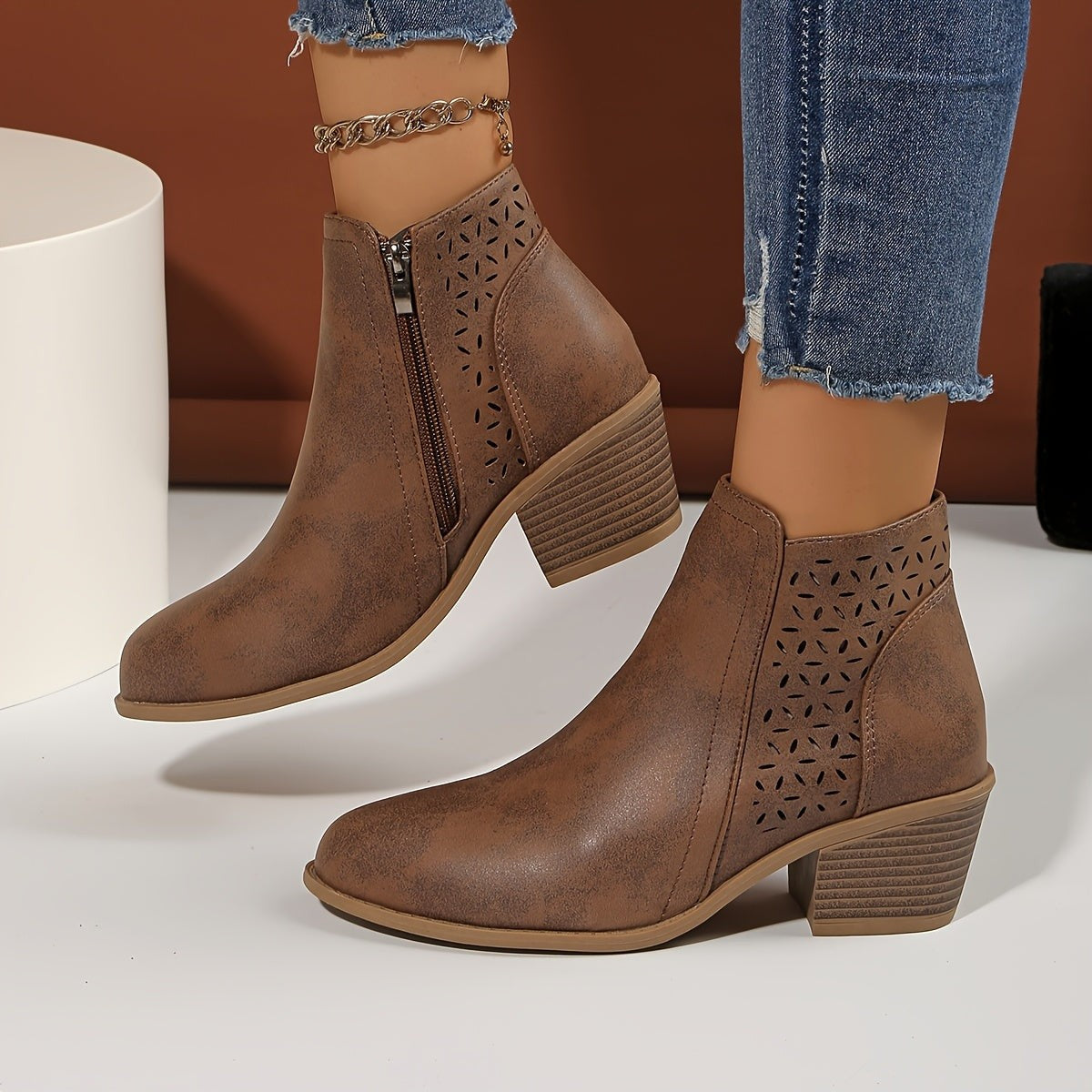 Brown perforated panel ankle boots, side view