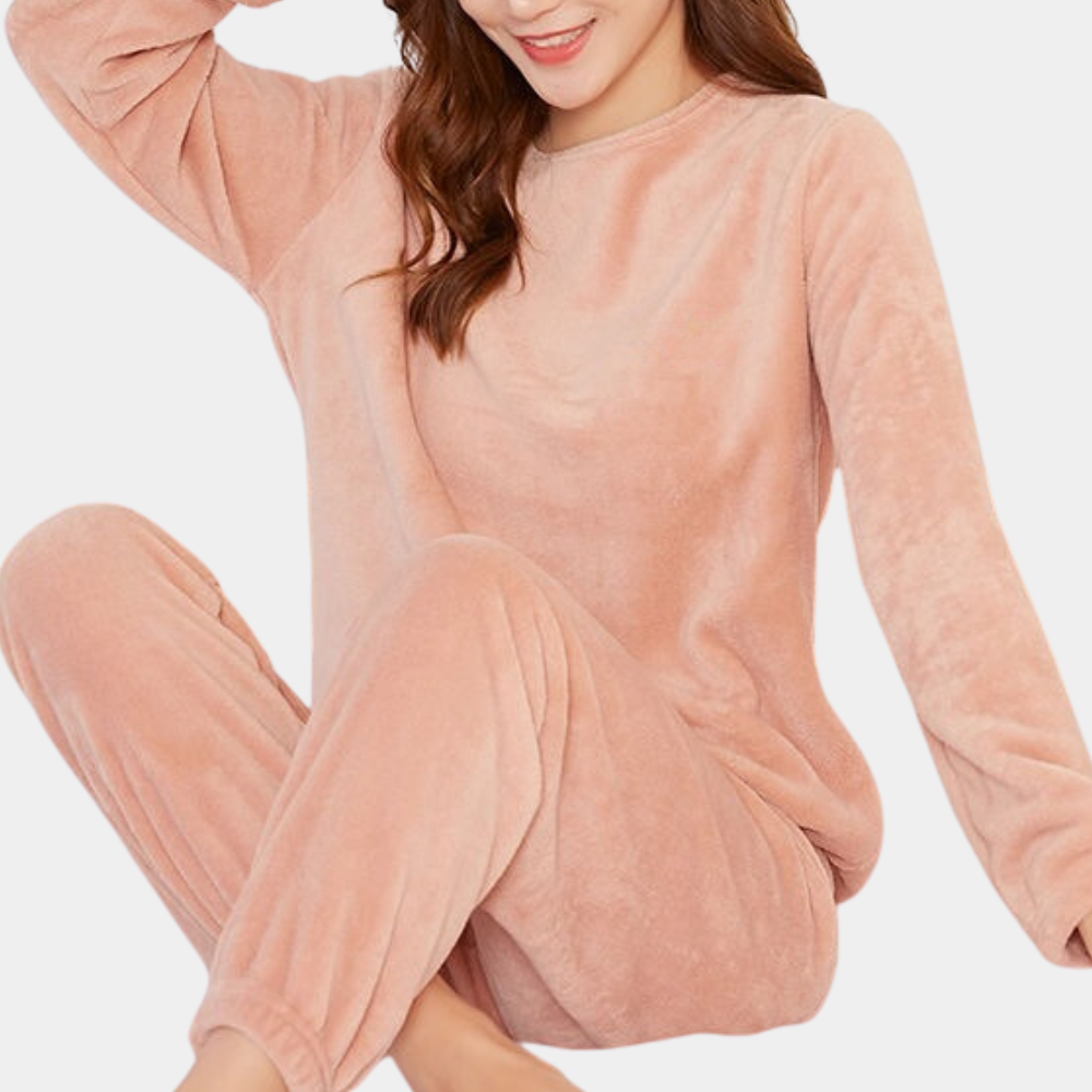 Pink plush fleece pajama set worn seated