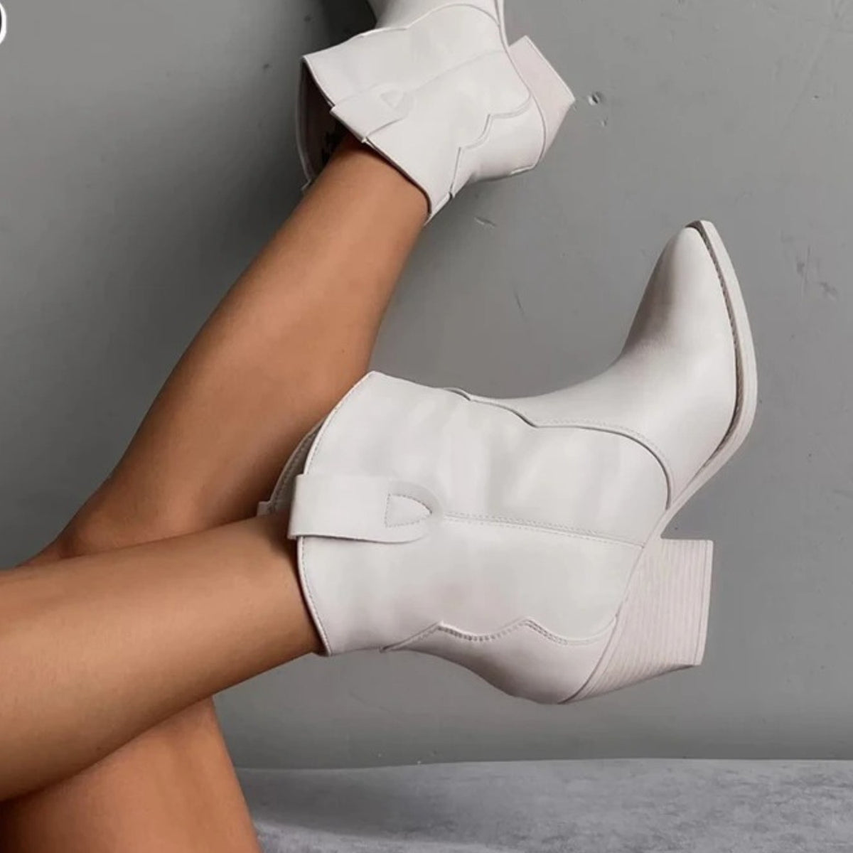 White pointed toe western ankle boots with a block heel