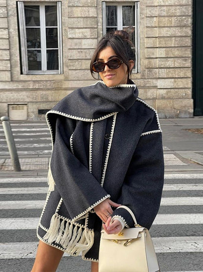 Charcoal scarf wrap coat worn on a city crosswalk