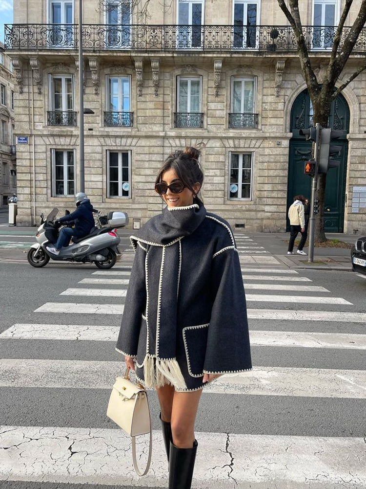Charcoal scarf wrap coat worn with knee boots on the street