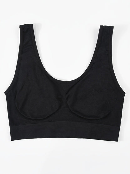 Black bralette laid flat showing the removable pads
