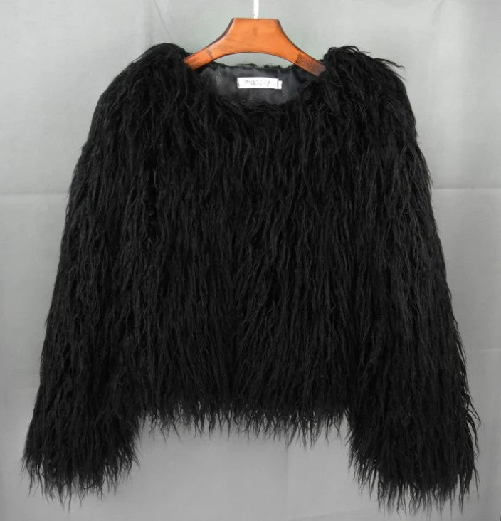 Black shaggy faux fur jacket on a hanger