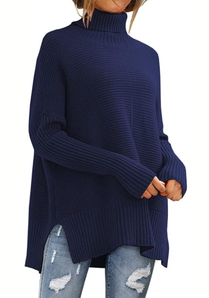 Navy side slit turtleneck sweater with jeans, front view