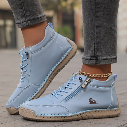 Women's lace-up side zip sneakers in light blue, side view showing the zip