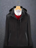 Black soft shell hooded jacket on a hanger
