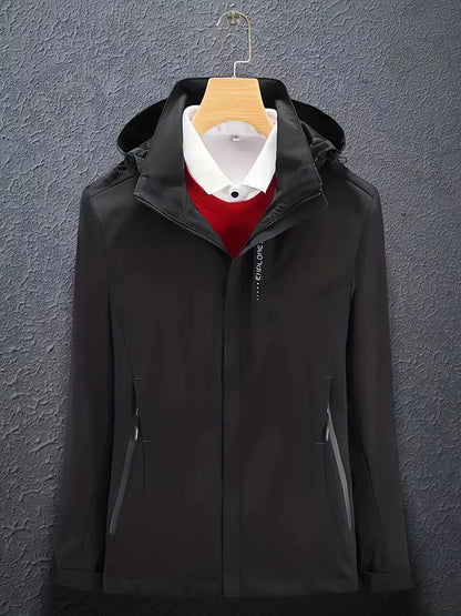 Black soft shell hooded jacket on a hanger