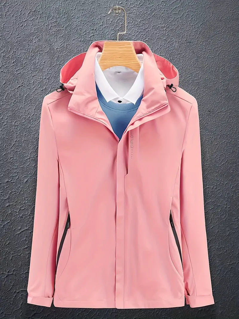 Pink soft shell hooded jacket on a hanger