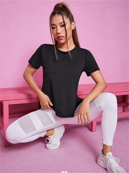 Black split back sport tee worn seated on a pink bench