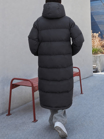 Black long puffer coat with hood up, back view