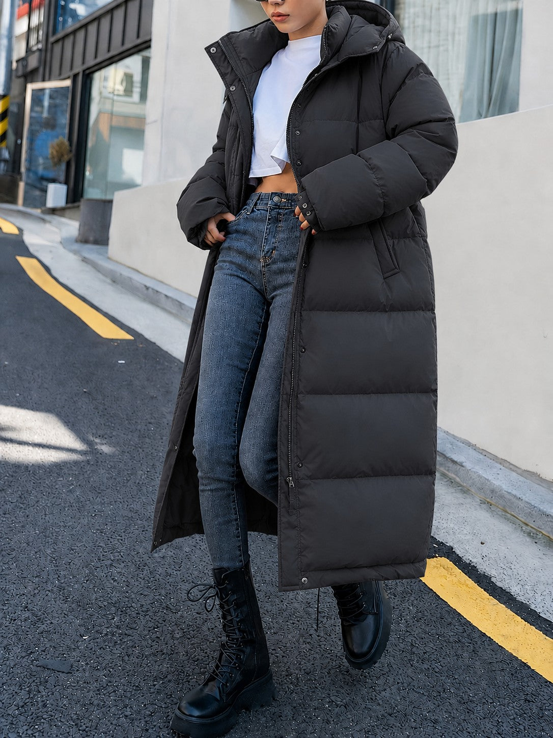 Black quilted maxi puffer coat, side walking view