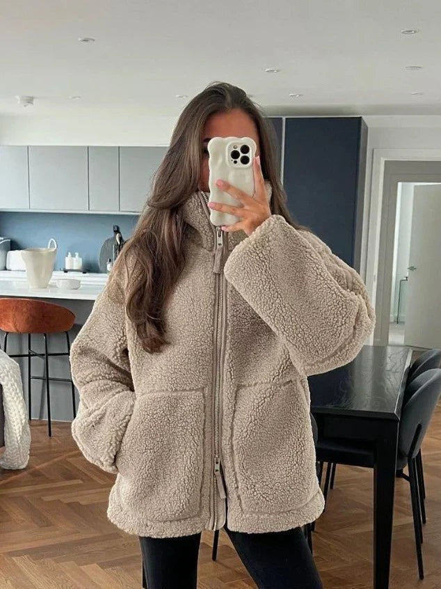 Oatmeal teddy jacket worn zipped up in a mirror selfie