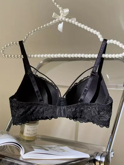 Inside view of the black strappy lace bra on a hanger