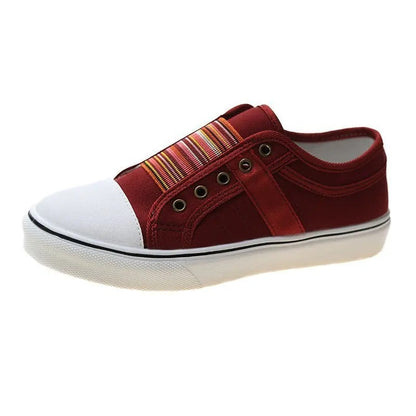 Red canvas slip-on sneaker with striped elastic panel