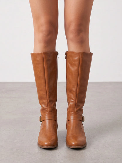 Tan leather riding boots with both ankle straps in view