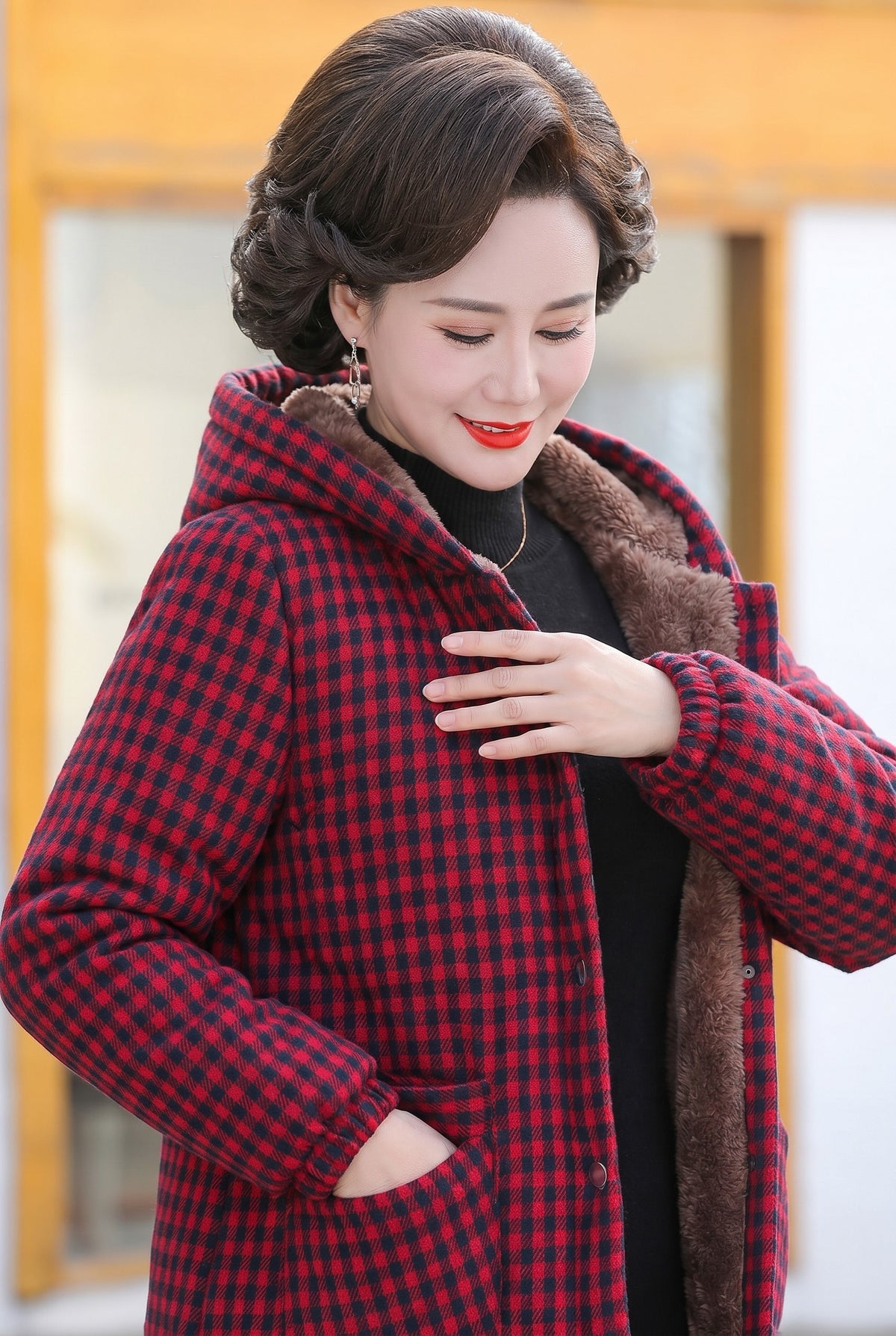 Red check teddy lined jacket worn with a dark top