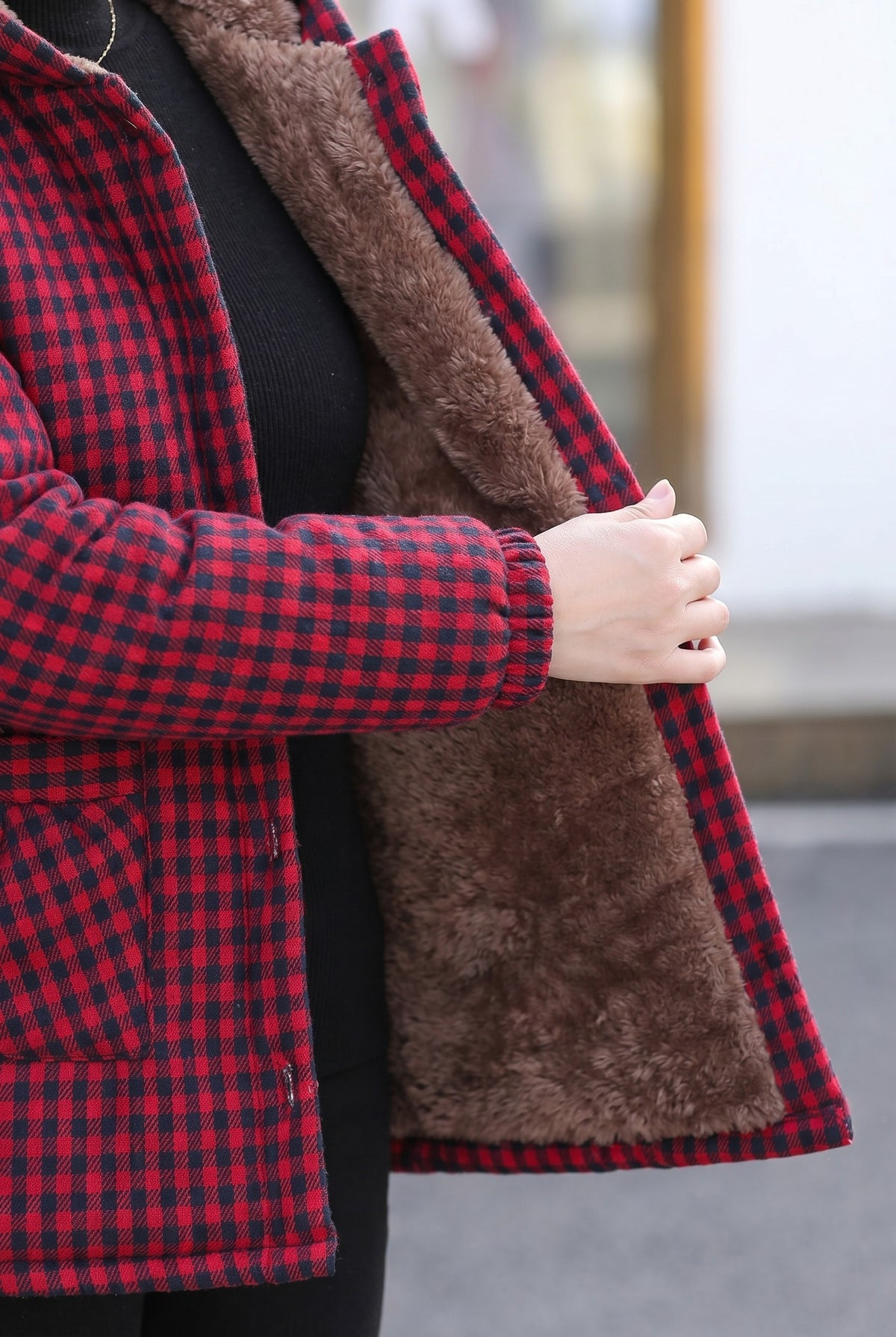 Close-up of the red check jacket teddy lining and cuff