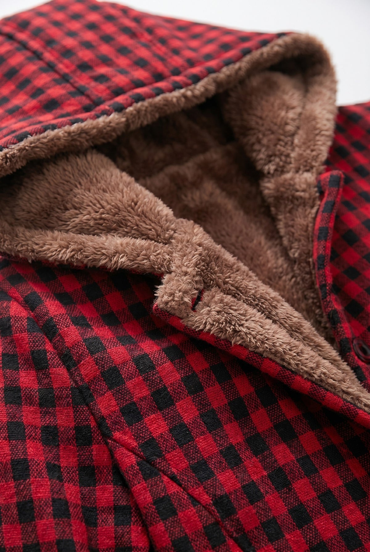 Close-up of the teddy lined hood on the red check jacket