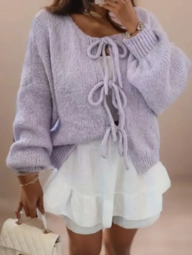 Lilac tie front knit cardigan on a model, front view with three bows