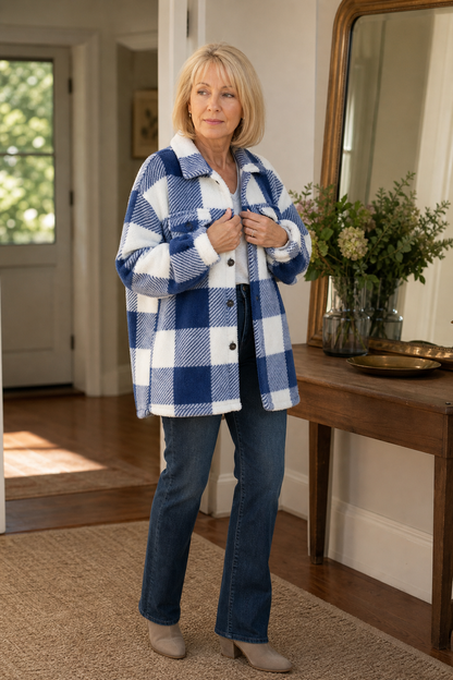 Blue buffalo check sherpa overshirt seen in a hallway mirror