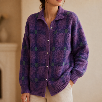 Purple checked knit cardigan worn with cream trousers