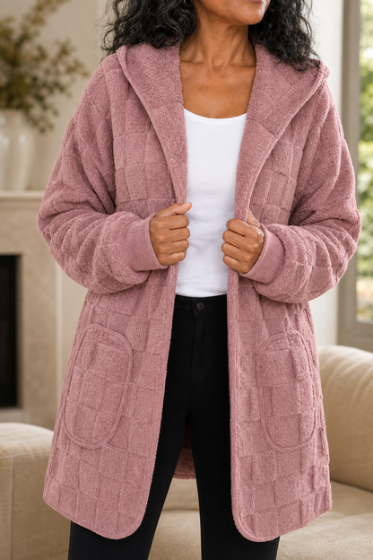 Dusty pink plush hooded cardigan worn over a white top