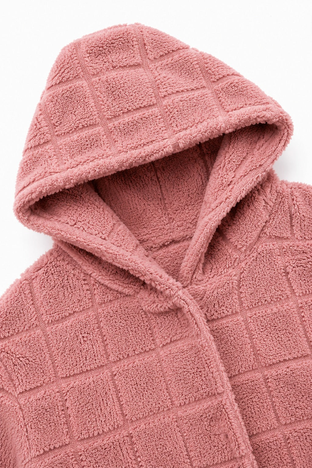 Hood and front edge of a dusty pink checkered plush cardigan