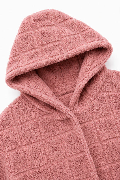 Hood and front edge of a dusty pink checkered plush cardigan