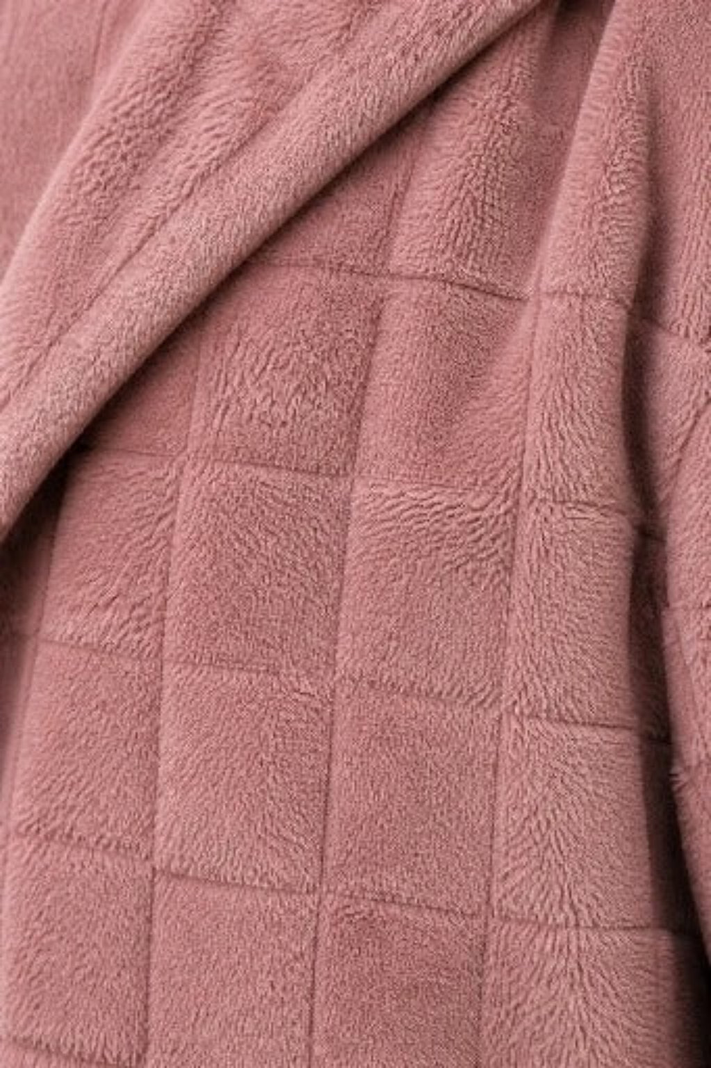 Close up of the checkered plush fleece in dusty pink