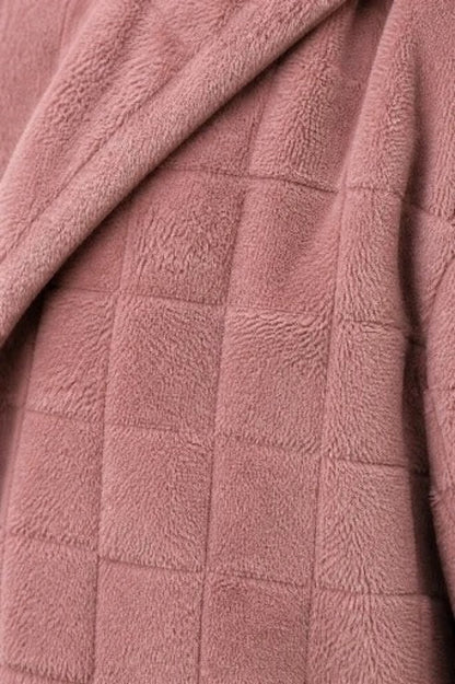 Close up of the checkered plush fleece in dusty pink