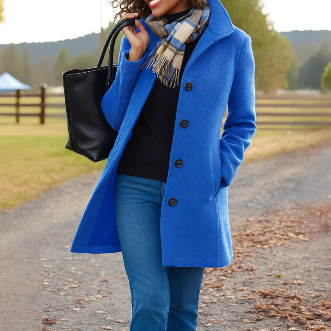 Cobalt blue button-front longline winter coat worn with jeans