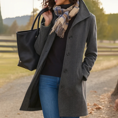 Charcoal button-front longline winter coat worn with jeans